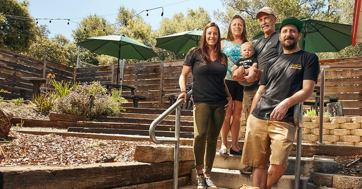 brewery family standing outside on brewery patio