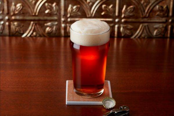 amber-brown-colored beer in glass