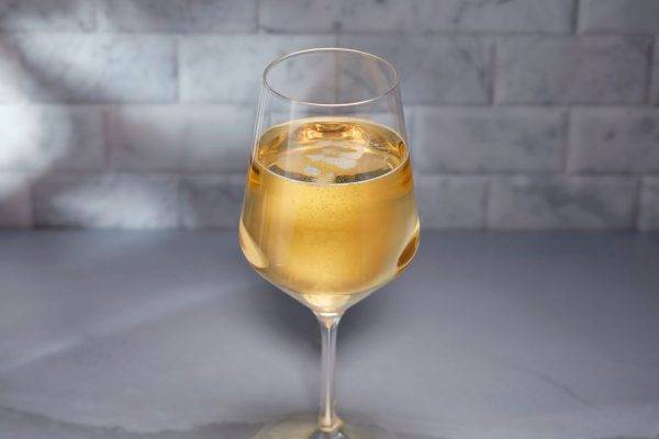 carbonated mead or cider in stemmed glass