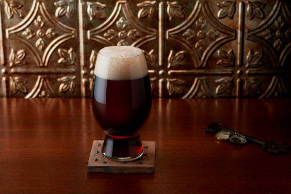 dark brown beer in glass