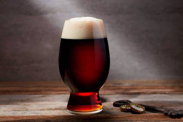 dark colored beer in glass