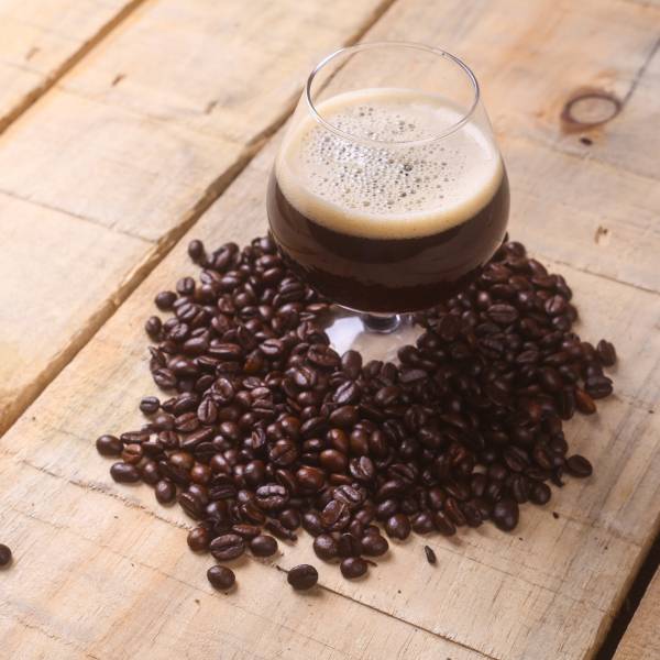 glass of beer with coffee beans