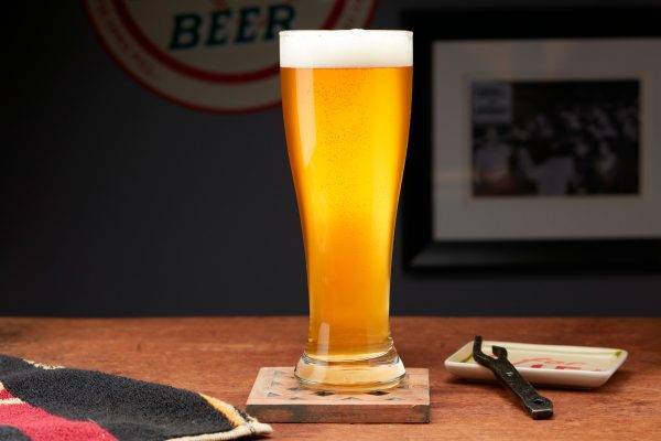 pale yellow beer in tall glass