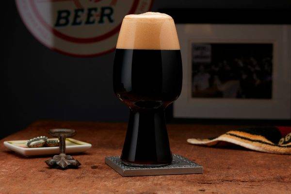 stout beer in glass on table